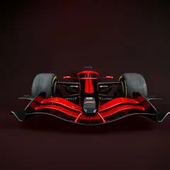 Ein rotes Formel 1 Auto mit schwarzer Nase und Streifen. Das Gewicht eines Formel 1 Autos ist entscheidend für die Performance.