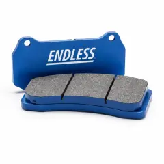 Zwei blaue Endless-Bremsbeläge mit grauem Reibmaterial auf weißem Hintergrund.