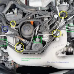 Motorraum mit markierten Schrauben und Leitungen, die für den Ausbau des AGR-Ventils relevant sind.