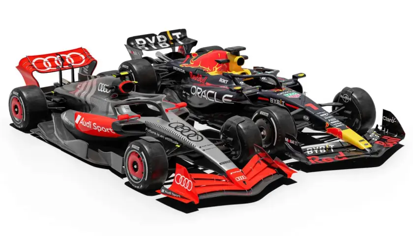 Zwei Formel 1 Autos im Vergleich: ein schwarzer Red Bull Racing Bolide und ein grauer Audi Sport Rennwagen.