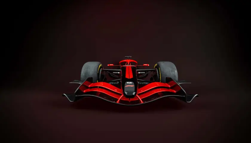 Ein rotes Formel 1 Auto mit schwarzer Nase und Streifen. Das Gewicht eines Formel 1 Autos ist entscheidend für die Performance.