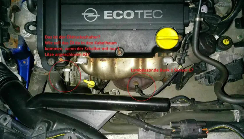 Opel Motorraum mit markiertem Öldruckschalter und Lambdasonde. Frage: Wie kommt Öl in den Kabelbaum? p0141.