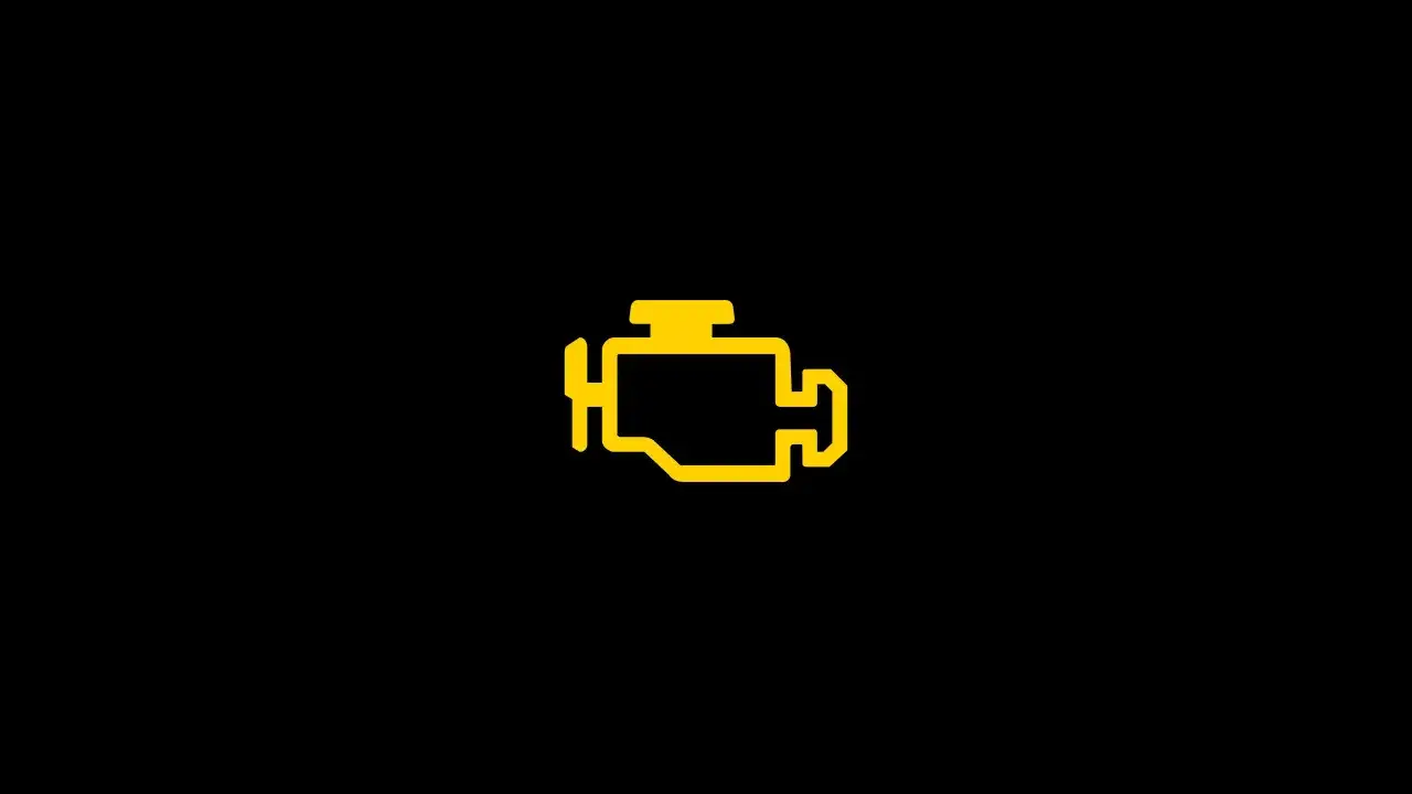 Gelbes Motorsymbol leuchtet auf dem schwarzen Armaturenbrett eines VW. P1624 VW.